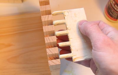 a comb to apply the glue