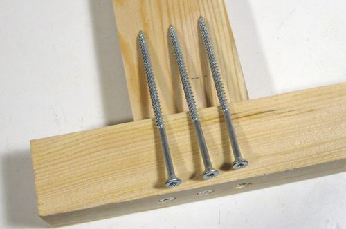 three screws lying on a joint